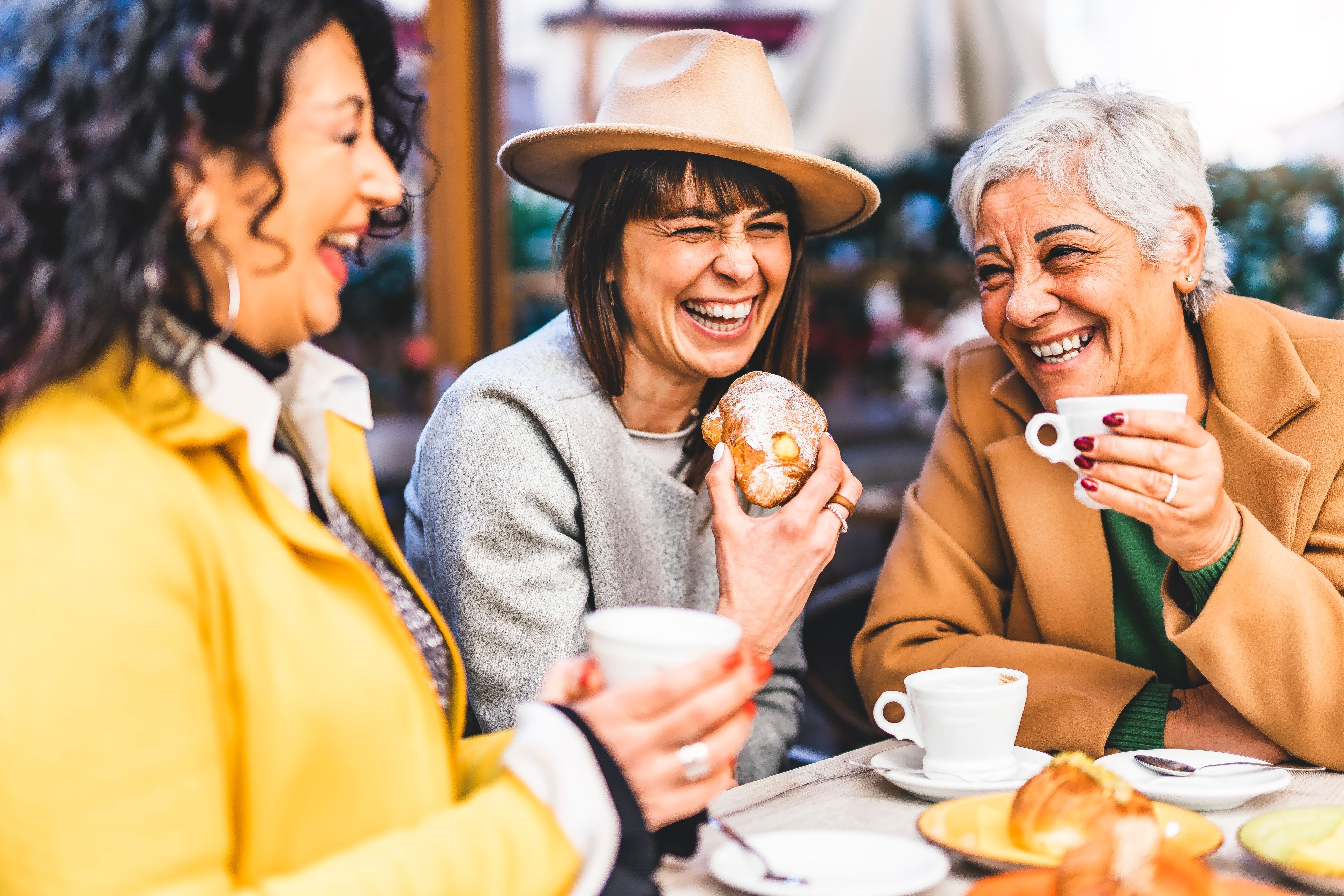 group of women of various ages sharing coffee and conversation